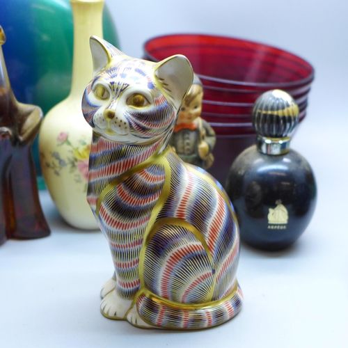 708 - A Royal Crown Derby cat paperweight with gold stopper, a Hummel figure, a heavy cased studio glass b... 