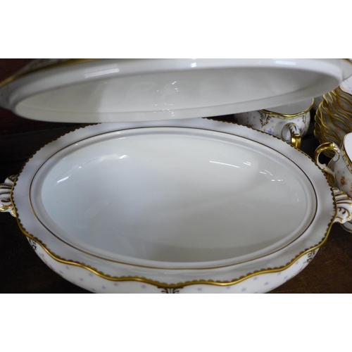 718 - A Royal Crown Derby Antoinette tea set with oval tureen, 2 x cream and sugar and bread and butter pl... 