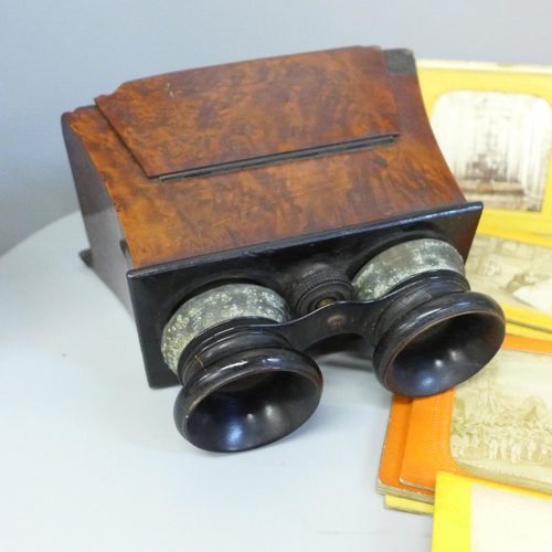 761 - A stereoscope viewer with 33 slides