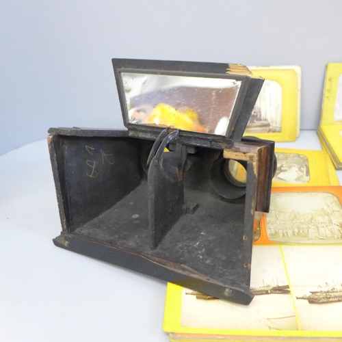 761 - A stereoscope viewer with 33 slides