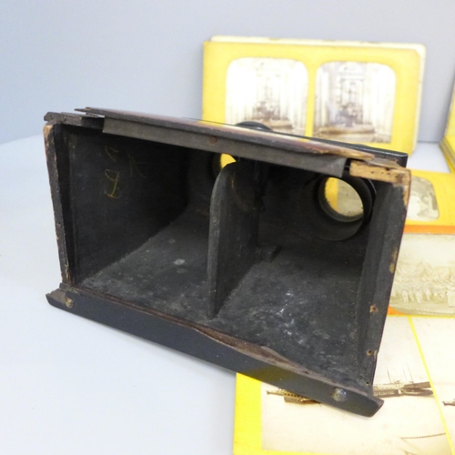 761 - A stereoscope viewer with 33 slides