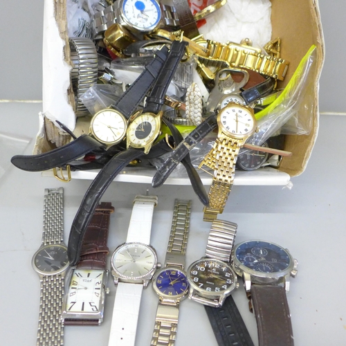 762 - A quantity of lady's and gentleman's wristwatches; Timex, Swatch, Sekonda, etc.