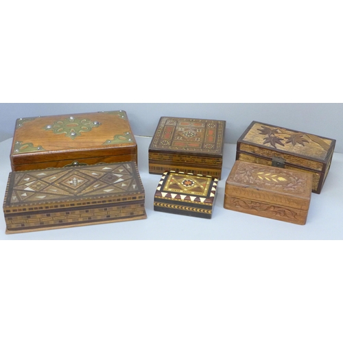 768 - Six boxes; three inlaid wooden boxes, an oriental carved wooden box, a metal inlaid box and one othe... 