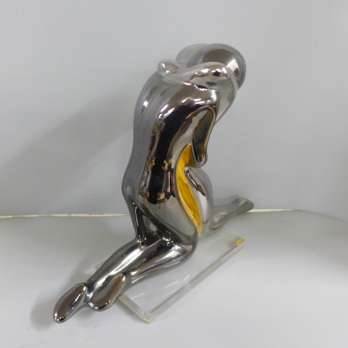 806 - A Galos Spain pottery figure of entwined lovers on a perspex plinth in silver finish, 31cm