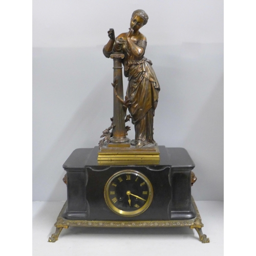 808 - A 19th Century French belge-noir mantel clock on a cast metal frame with patinated bronze sculpture ... 