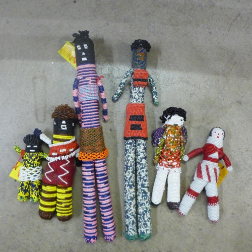 814 - Tribal art; six South African beaded dolls