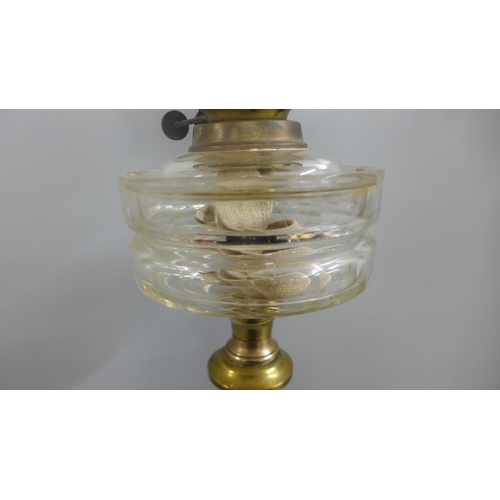 821 - A brass and glass oil lamp **PLEASE NOTE THIS LOT IS NOT ELIGIBLE FOR IN-HOUSE POSTING AND PACKING**