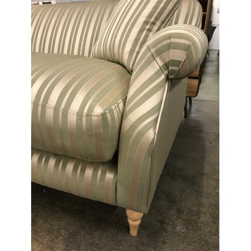 1454 - A green and gold striped upholstered two seater sofa