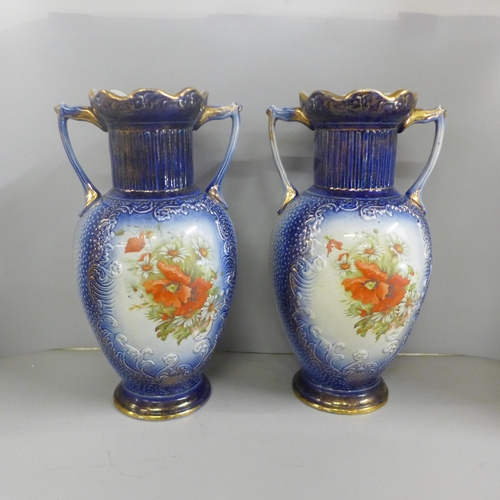 823 - A pair of large blue pottery transfer printed vases with floral decoration, 35cm **PLEASE NOTE THIS ... 