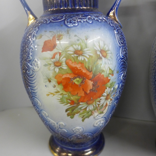 823 - A pair of large blue pottery transfer printed vases with floral decoration, 35cm **PLEASE NOTE THIS ... 