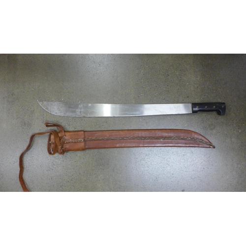 833 - A Legitimo Collins & Co. Vietnam War machete with original leather scabbard, (later added binder)