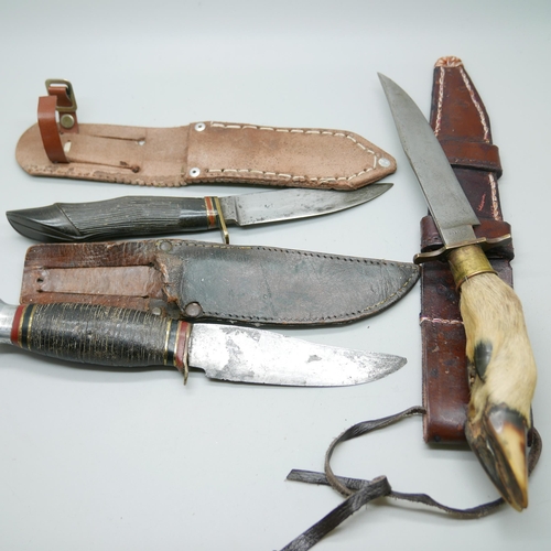 839 - A Southern & Richardson Sheffield knife with leather scabbard, a horn handle knife with leather scab... 