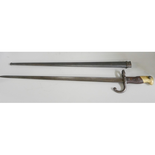 841 - A French gras bayonet with scabbard, marked St. Ettienne 1875