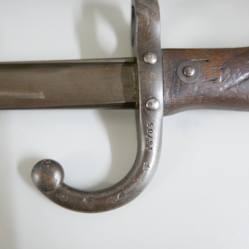 841 - A French gras bayonet with scabbard, marked St. Ettienne 1875