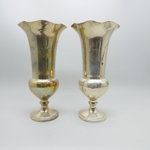 848 - A pair of silver vases, by William Comyns, 15cm, weighted