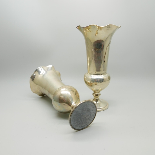 848 - A pair of silver vases, by William Comyns, 15cm, weighted