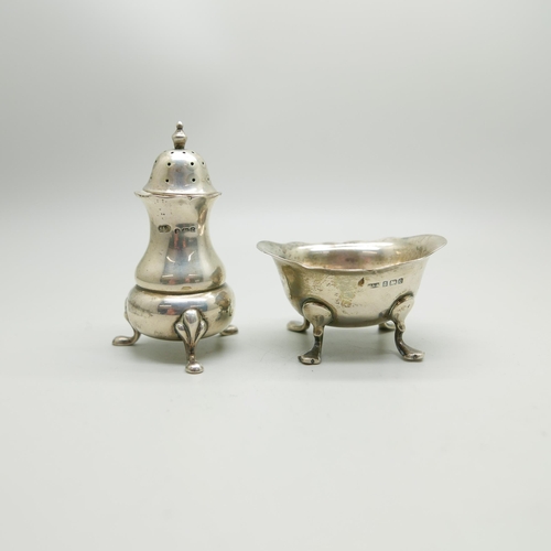 864 - A silver pepper and a pierced silver dish, 66g