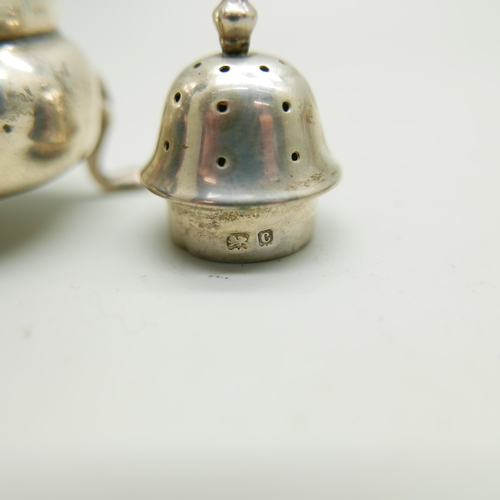 864 - A silver pepper and a pierced silver dish, 66g