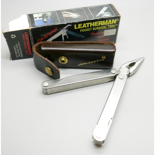 875 - A Leatherman pocket survival tool, The Original, with leather case and outer box