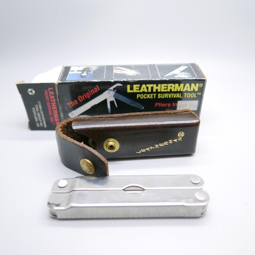 875 - A Leatherman pocket survival tool, The Original, with leather case and outer box