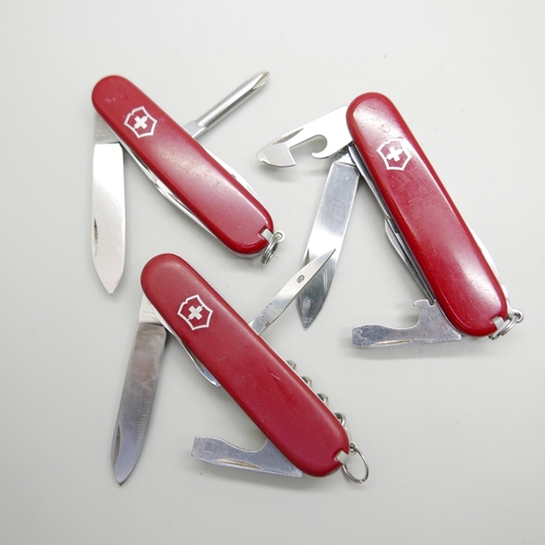 876 - Three Victorinox Swiss multi-tool knives