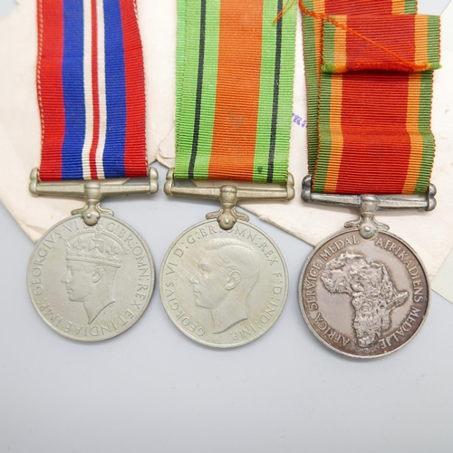 886 - A set of WWII medals including Africa Service Medal to 543697 W.F. Appel, with paperwork and envelop... 