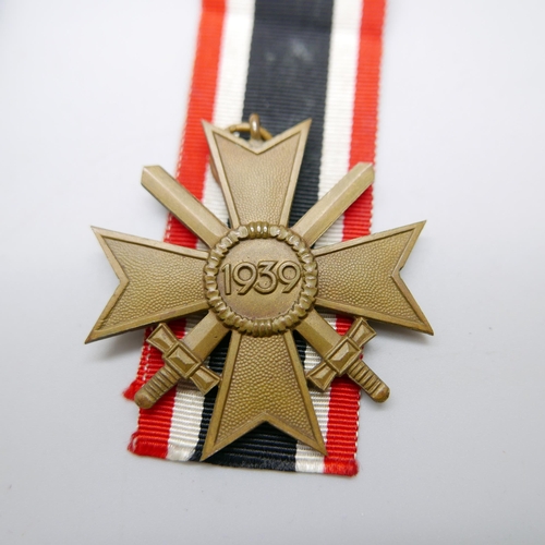 893 - A German Third Reich War Merit Cross and a Winston Churchill medallion