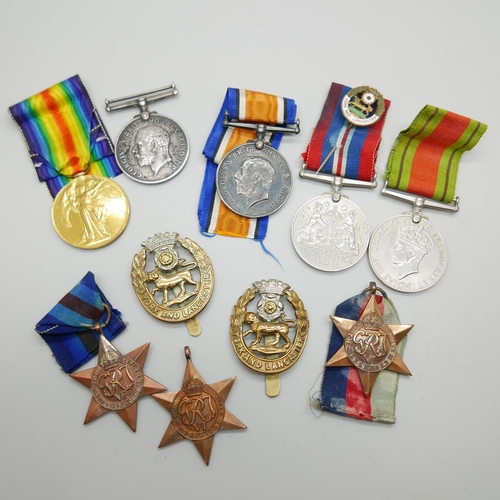 896 - Eight medals and two badges; including a pair of WWI medals to S4-143747 W.O. CL. 2. J.W. Speck ASC ... 