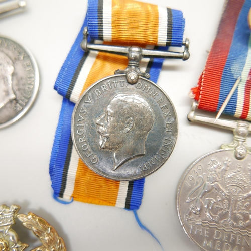 896 - Eight medals and two badges; including a pair of WWI medals to S4-143747 W.O. CL. 2. J.W. Speck ASC ... 