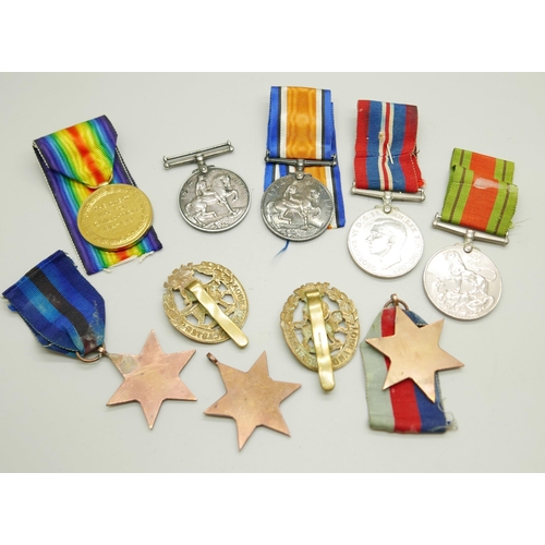 896 - Eight medals and two badges; including a pair of WWI medals to S4-143747 W.O. CL. 2. J.W. Speck ASC ... 