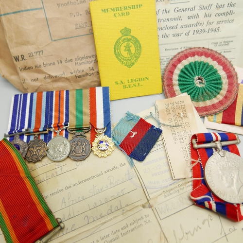 903 - Assorted WWII medals, etc., including four to 21777 K.J. Hanssen with original address envelope