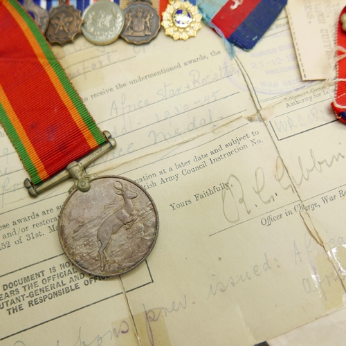 903 - Assorted WWII medals, etc., including four to 21777 K.J. Hanssen with original address envelope