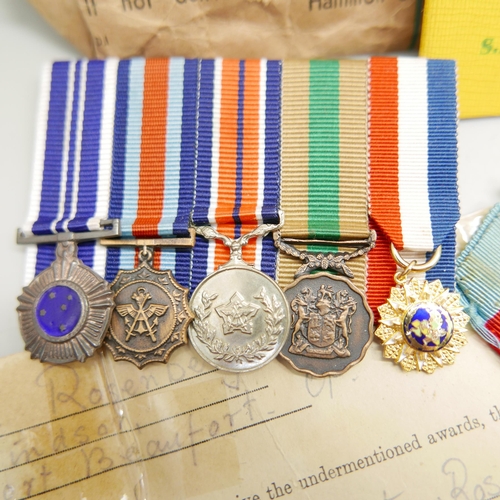 903 - Assorted WWII medals, etc., including four to 21777 K.J. Hanssen with original address envelope