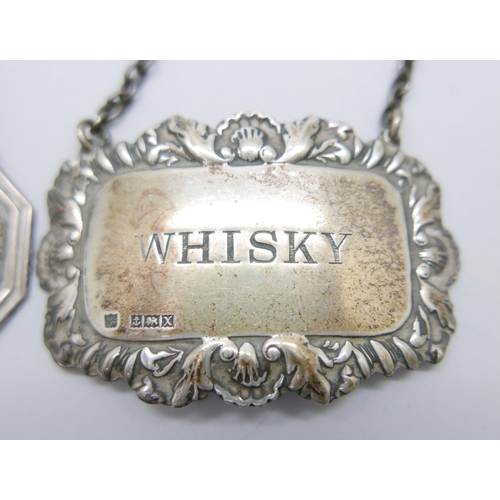 909 - Two silver whisky labels