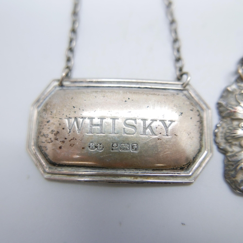 909 - Two silver whisky labels