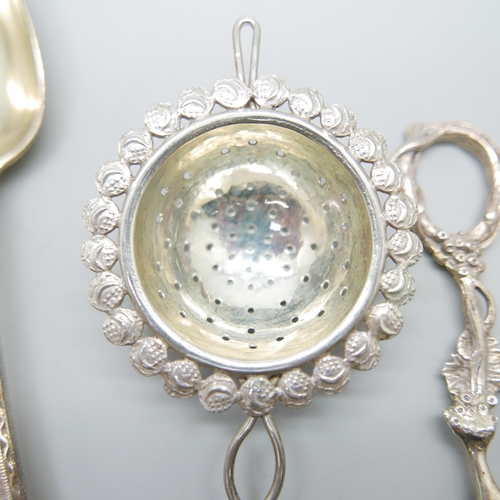 914 - A Victorian silver spoon by George Adams, a strainer and a pair of silver grape scissors, (spoon and... 