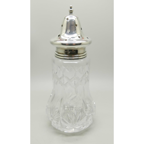 938 - A silver condiment set, cased, and a silver topped shaker, 80g