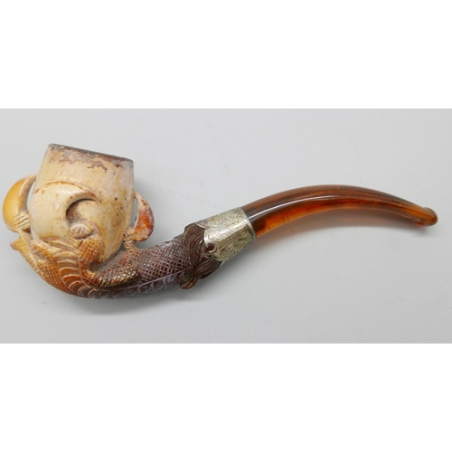 939 - An early 20th Century eagle's claw, pipe, with amber stem and silver collar, cased Meerschaum