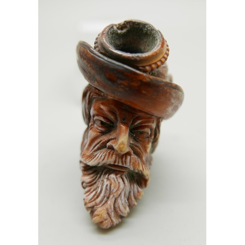 940 - A 19th Century Meerschaum pipe with amber stem, Bavarian man with beard and hat with feather