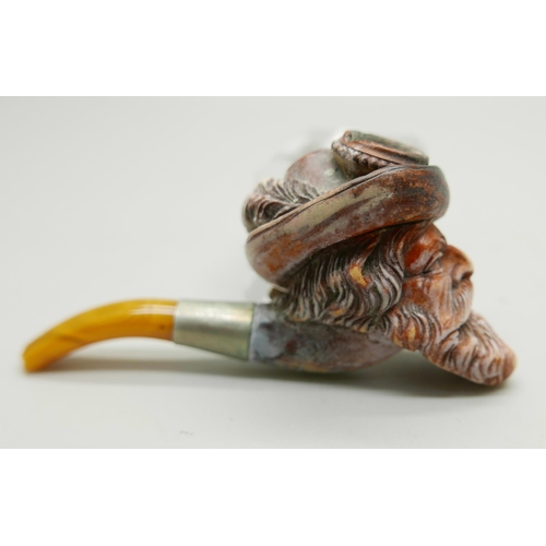 940 - A 19th Century Meerschaum pipe with amber stem, Bavarian man with beard and hat with feather