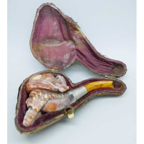 940 - A 19th Century Meerschaum pipe with amber stem, Bavarian man with beard and hat with feather