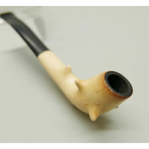 941 - Three carved Meerschaum pipes, cased