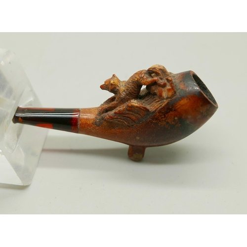 941 - Three carved Meerschaum pipes, cased