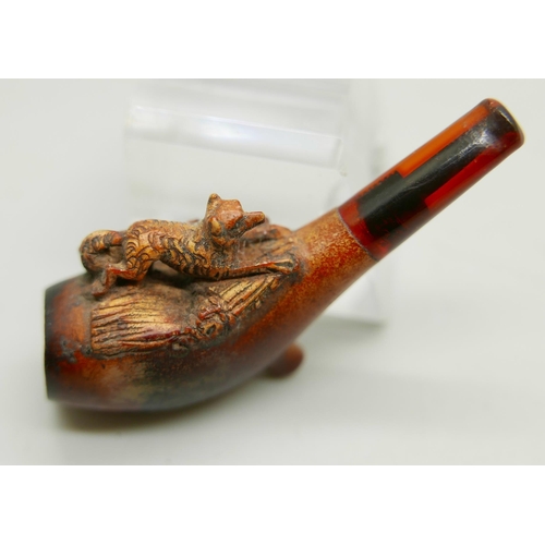 941 - Three carved Meerschaum pipes, cased