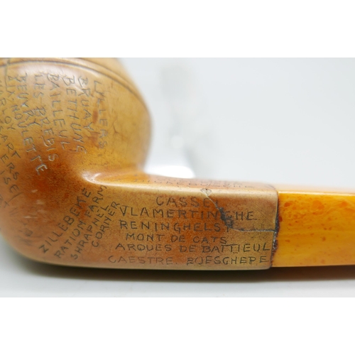 942 - An early 20th Century Meerschaum pipe, missing end of amber stem, carved with fifty-two different lo... 