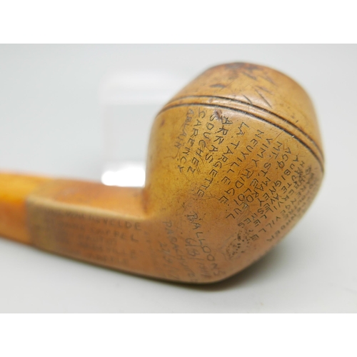 942 - An early 20th Century Meerschaum pipe, missing end of amber stem, carved with fifty-two different lo... 