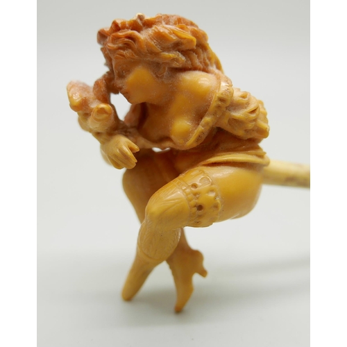 943 - A carved Meerschaum pipe of a scantily clad young lady, with bone stem separate, cased