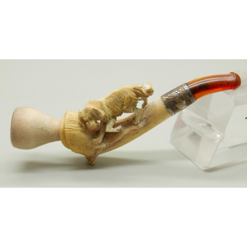 944 - Three carved Meerschaum pipes, cased