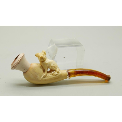 944 - Three carved Meerschaum pipes, cased