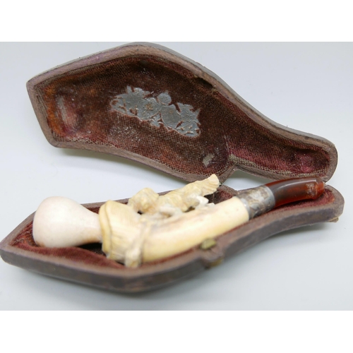 944 - Three carved Meerschaum pipes, cased